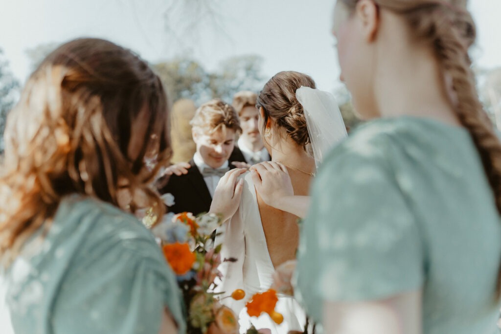 Bride and groom being prayed for