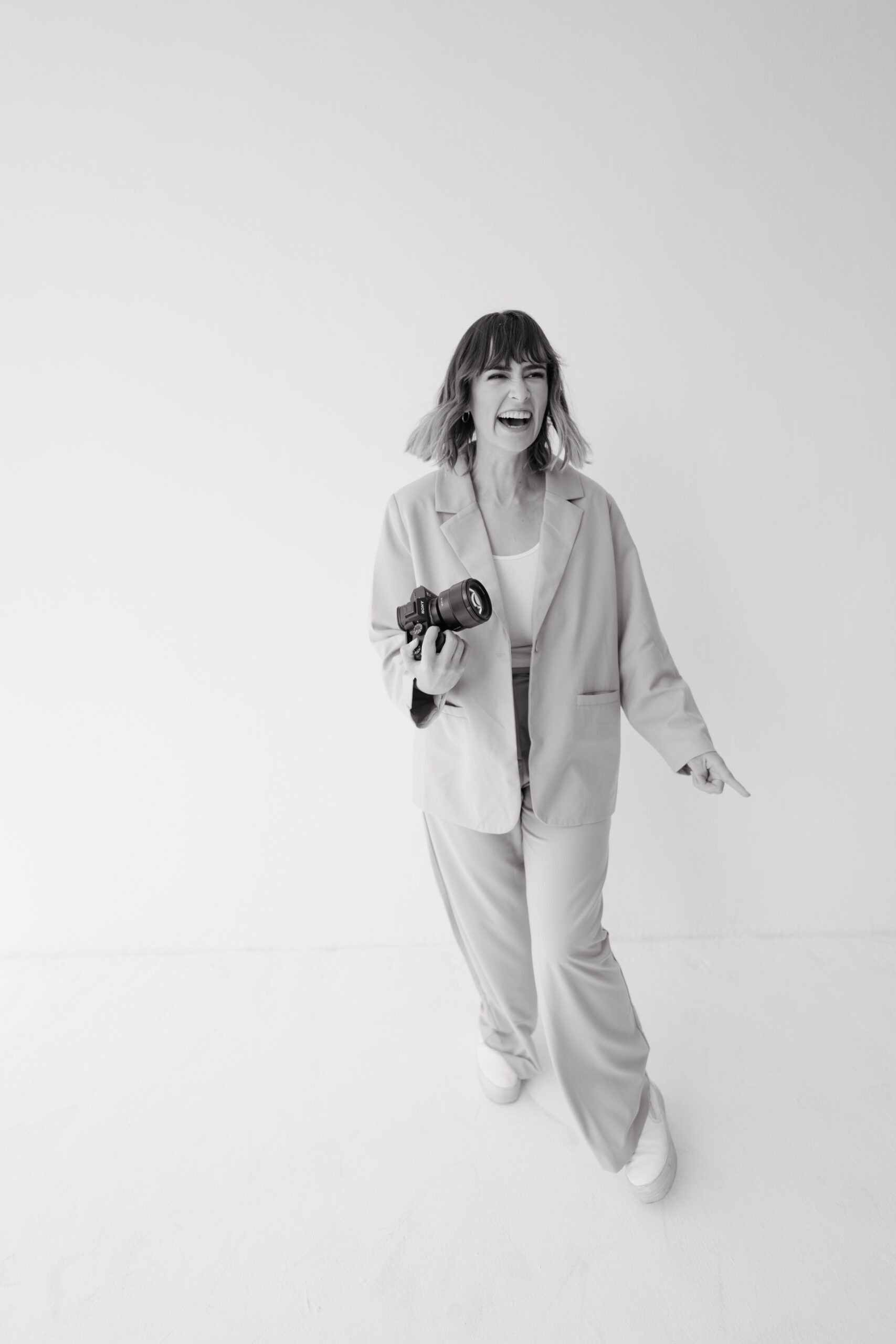 Happy photographer in cool suit