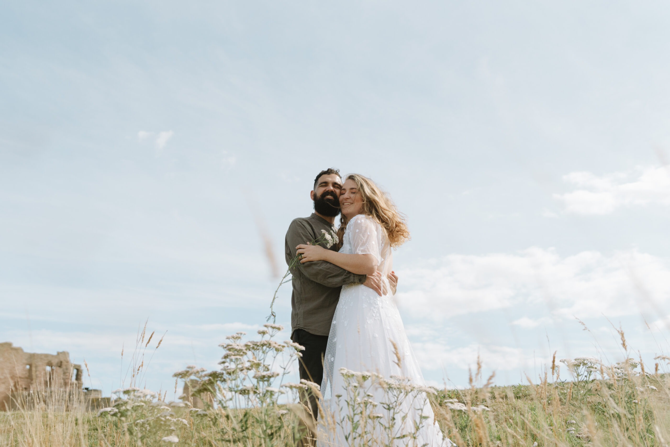 Bride and Groom cuddling on their wedding day in the United Kingdom