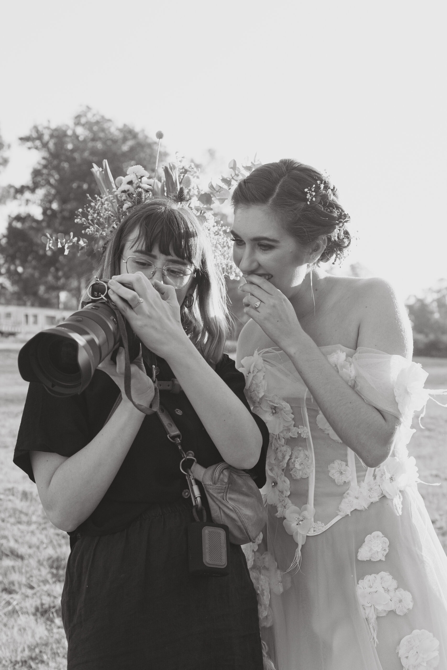 Wedding Photographer showing bride back of camera