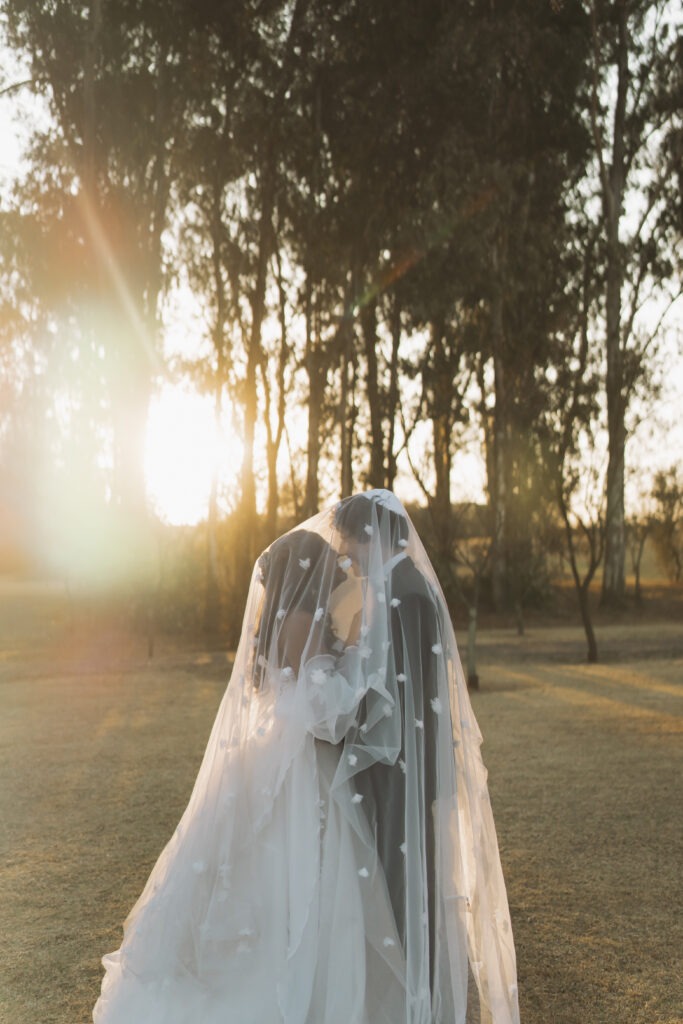 Couple kissing at sunset