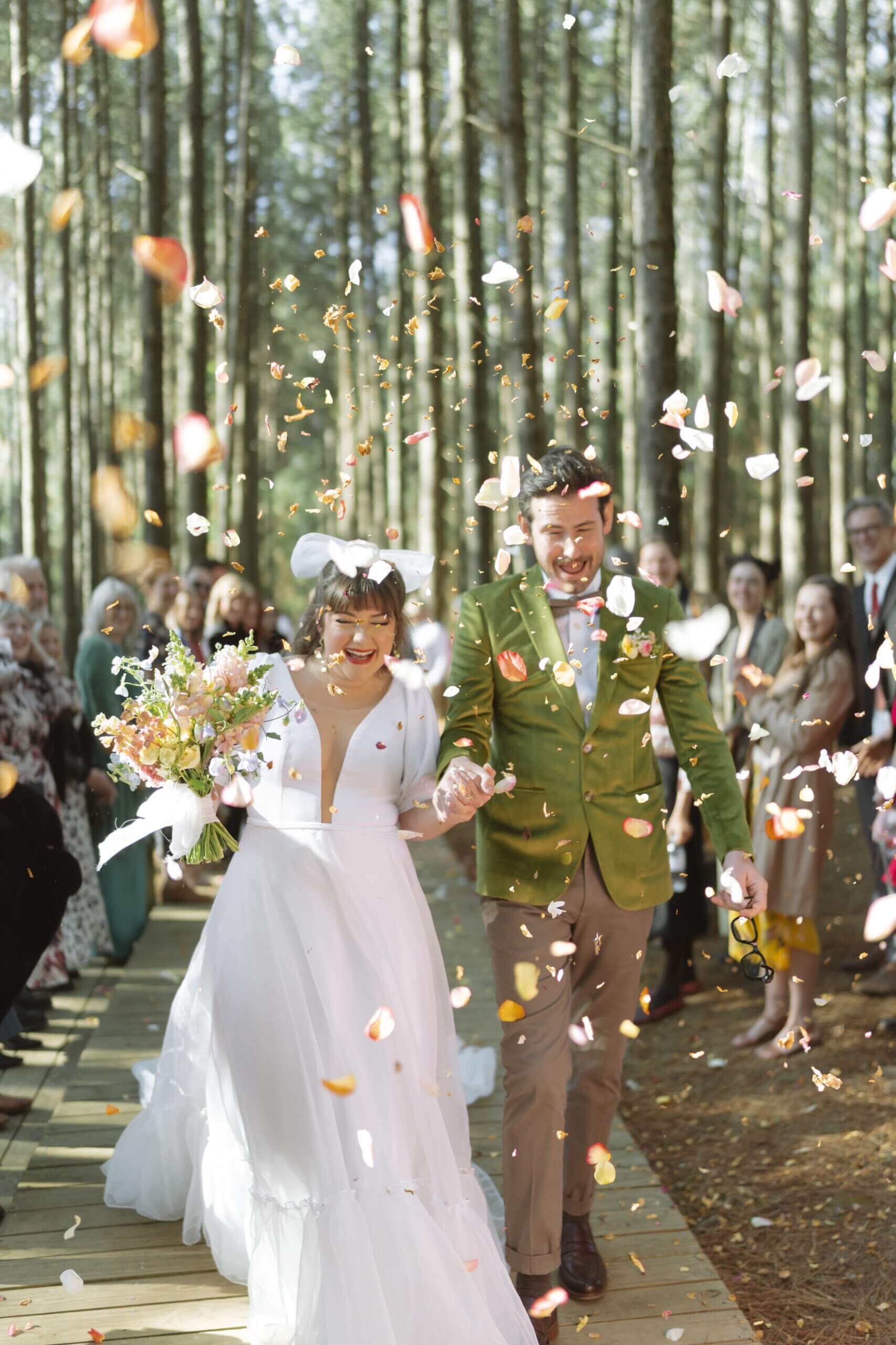 Trendy Bride and Groom in confetti tunnel in Cape Town