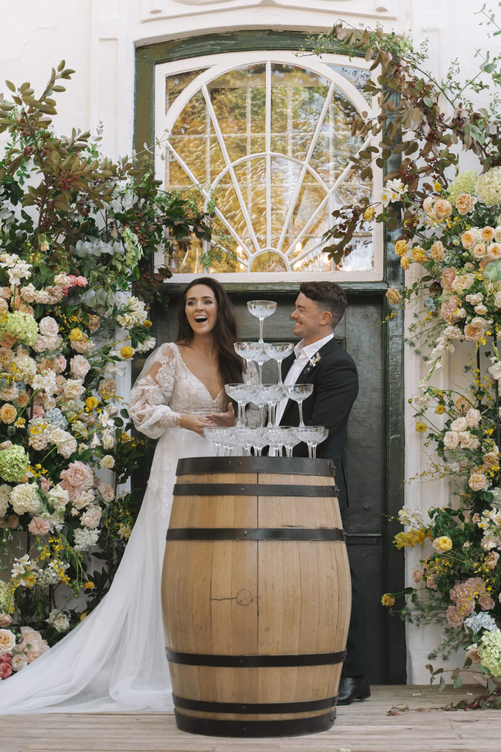 Bride and groom laughing at their luxury wedding in Cape Town Winelands