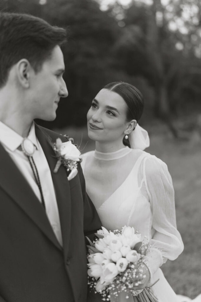 Trendy, fine-art and Editorial bride looking at groom in Cape Town