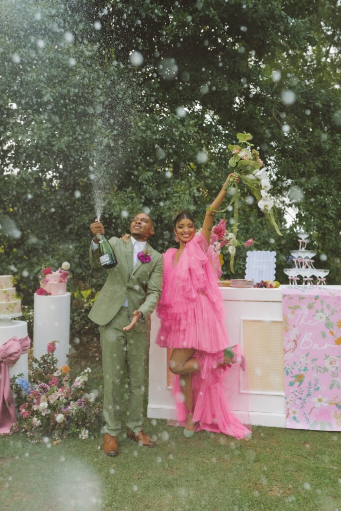 Fun, vibrant photography of African couple wearing bright colours in Cape Town winelands