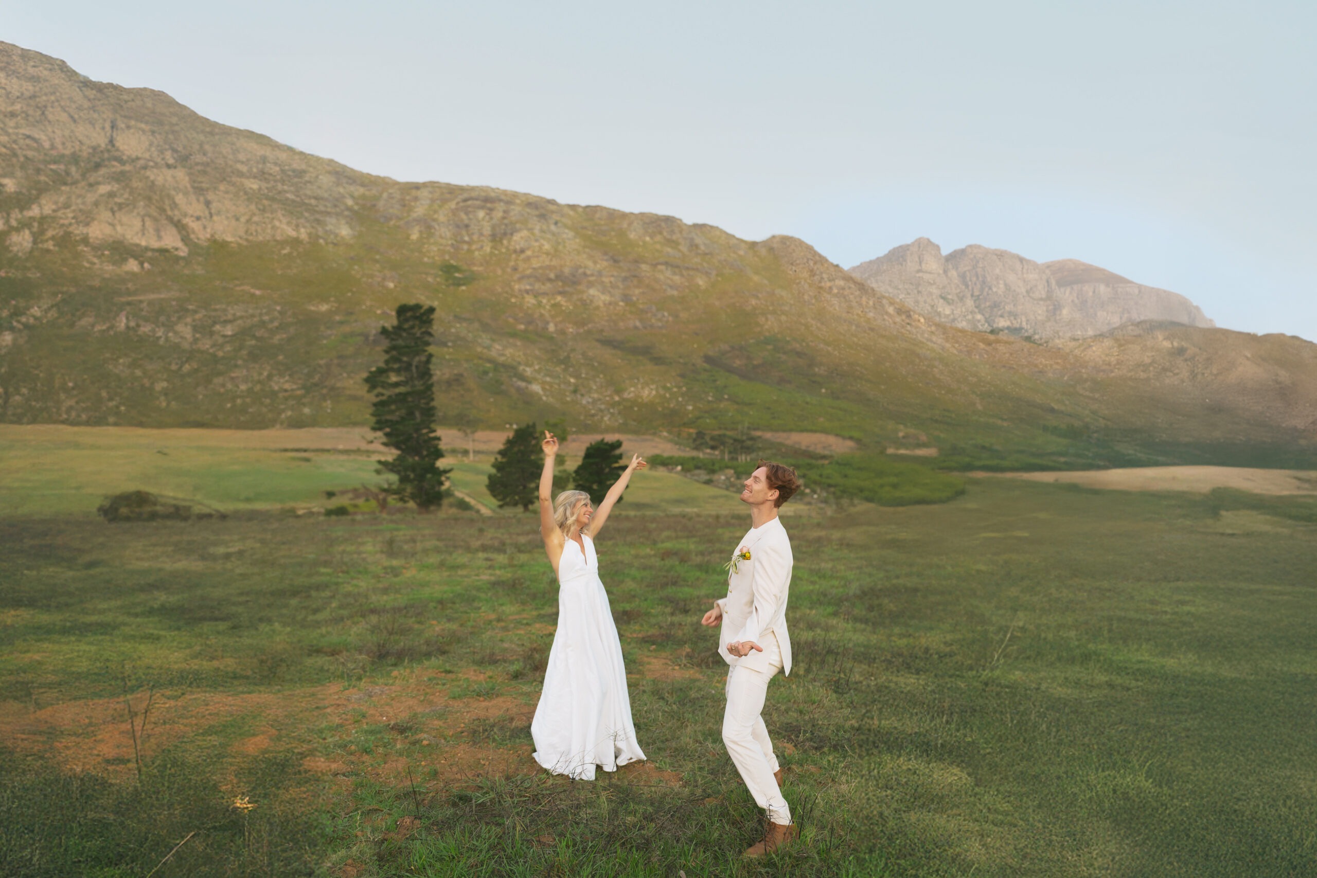 Cape Town bride and groom dancing in mountains