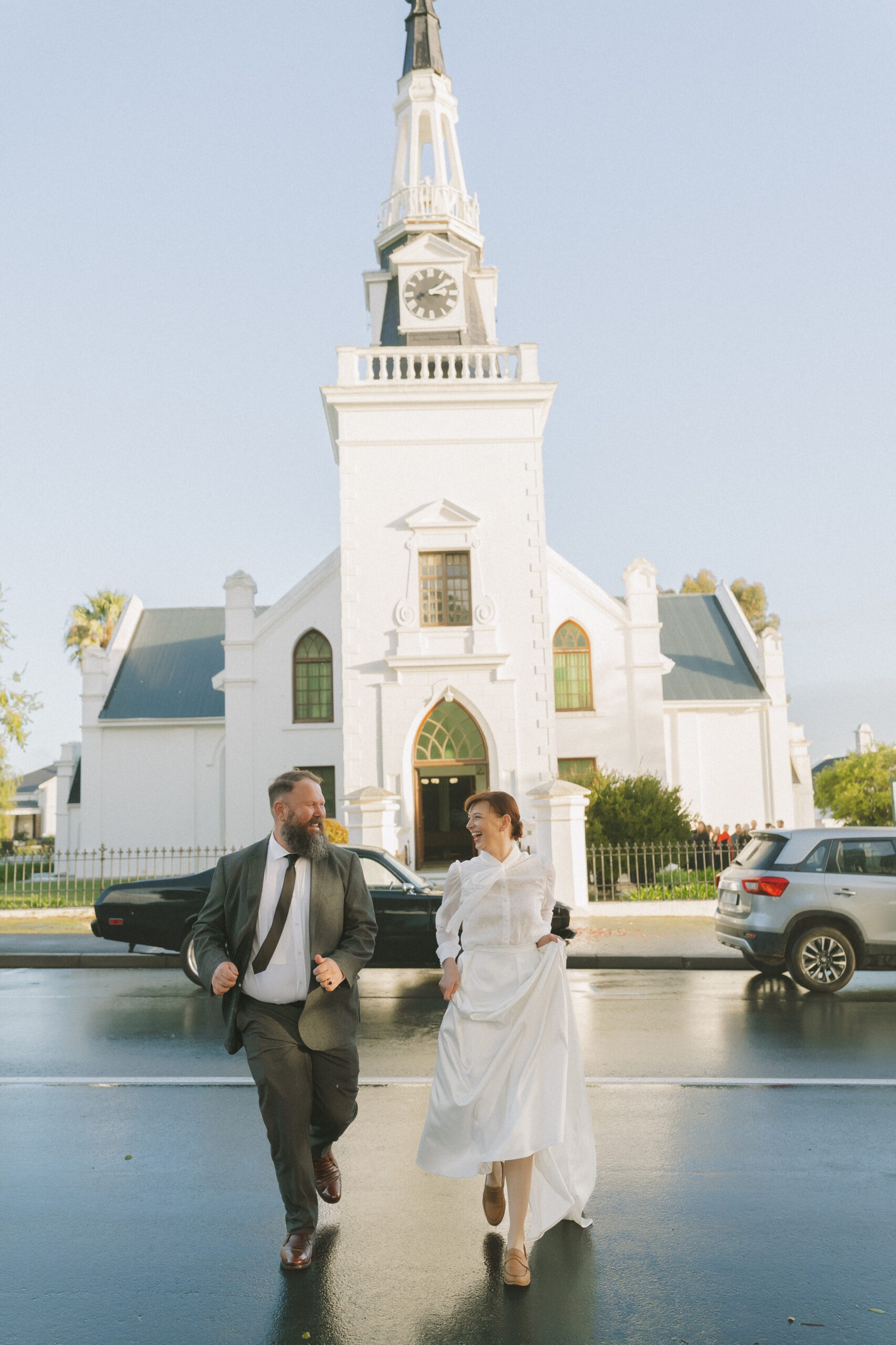 Wedding coupe running across street in Cape Town, Western Cape
