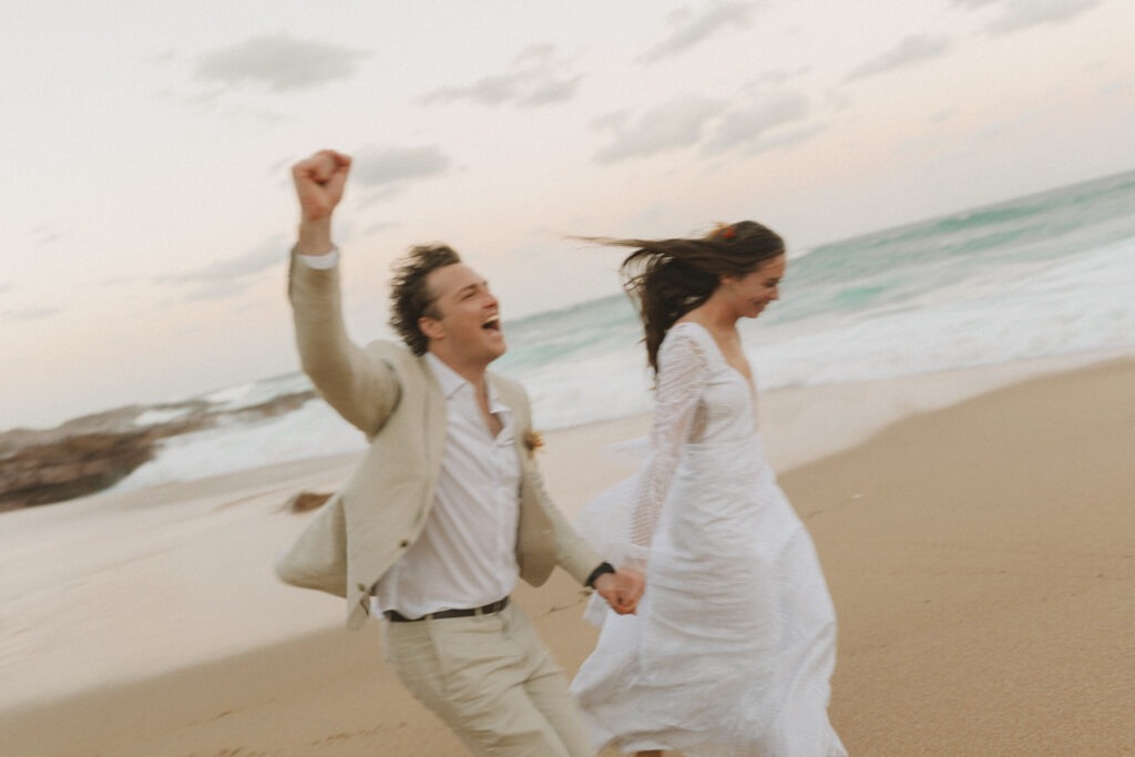 Candid and fun wedding photography of couple at their Cape Town beach wedding