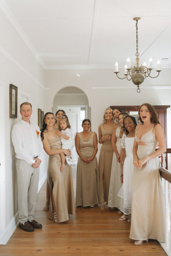 Candid and emotive photography of bridesmaids seeing bride in Cape Town